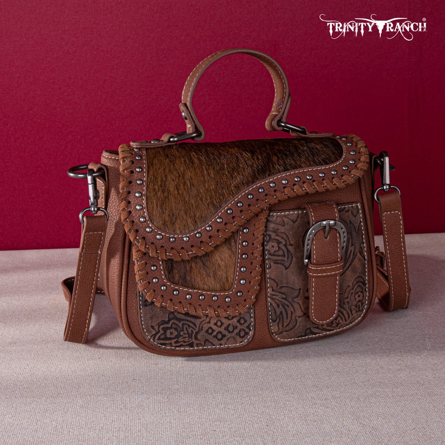 TR1498360BR - Trinity Ranch Hair-On Cowhide Saddle Shape Collection Crossbody/Satchel Brown