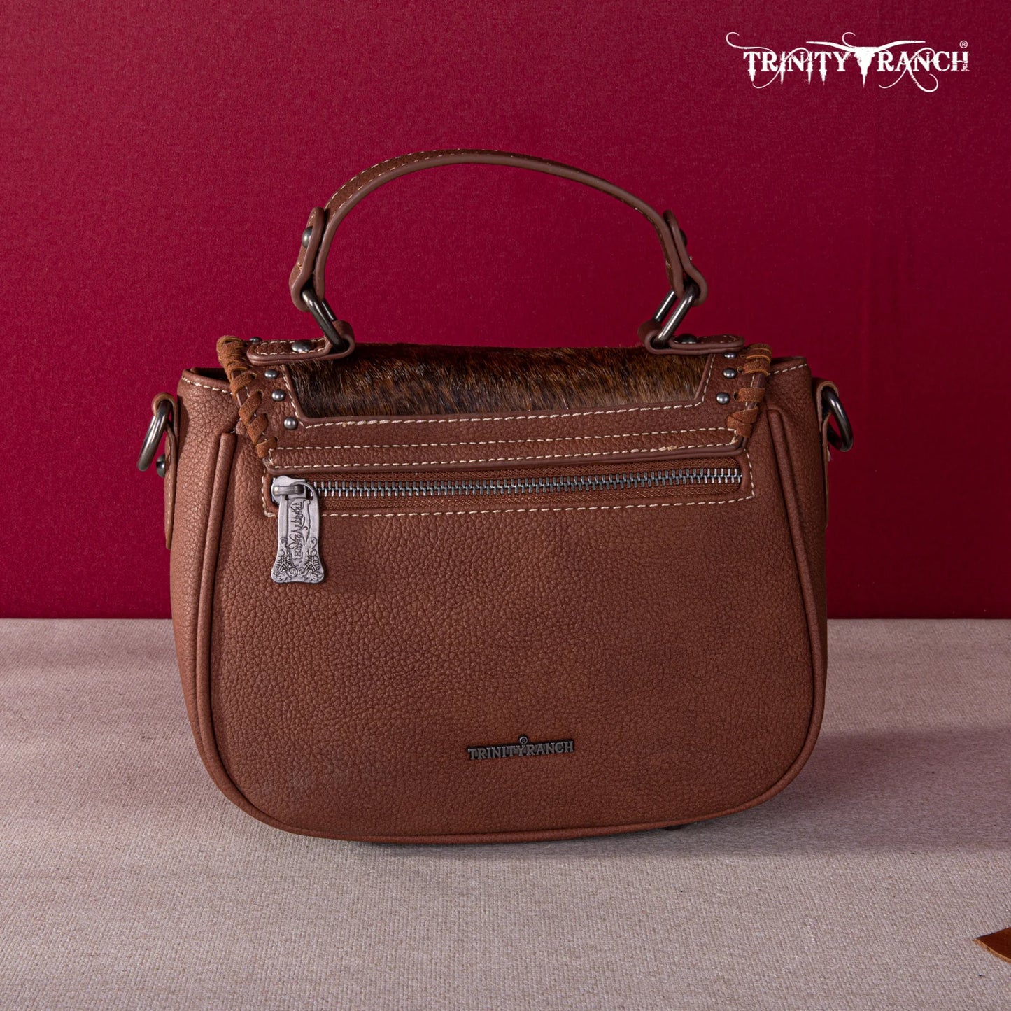 TR1498360BR - Trinity Ranch Hair-On Cowhide Saddle Shape Collection Crossbody/Satchel Brown