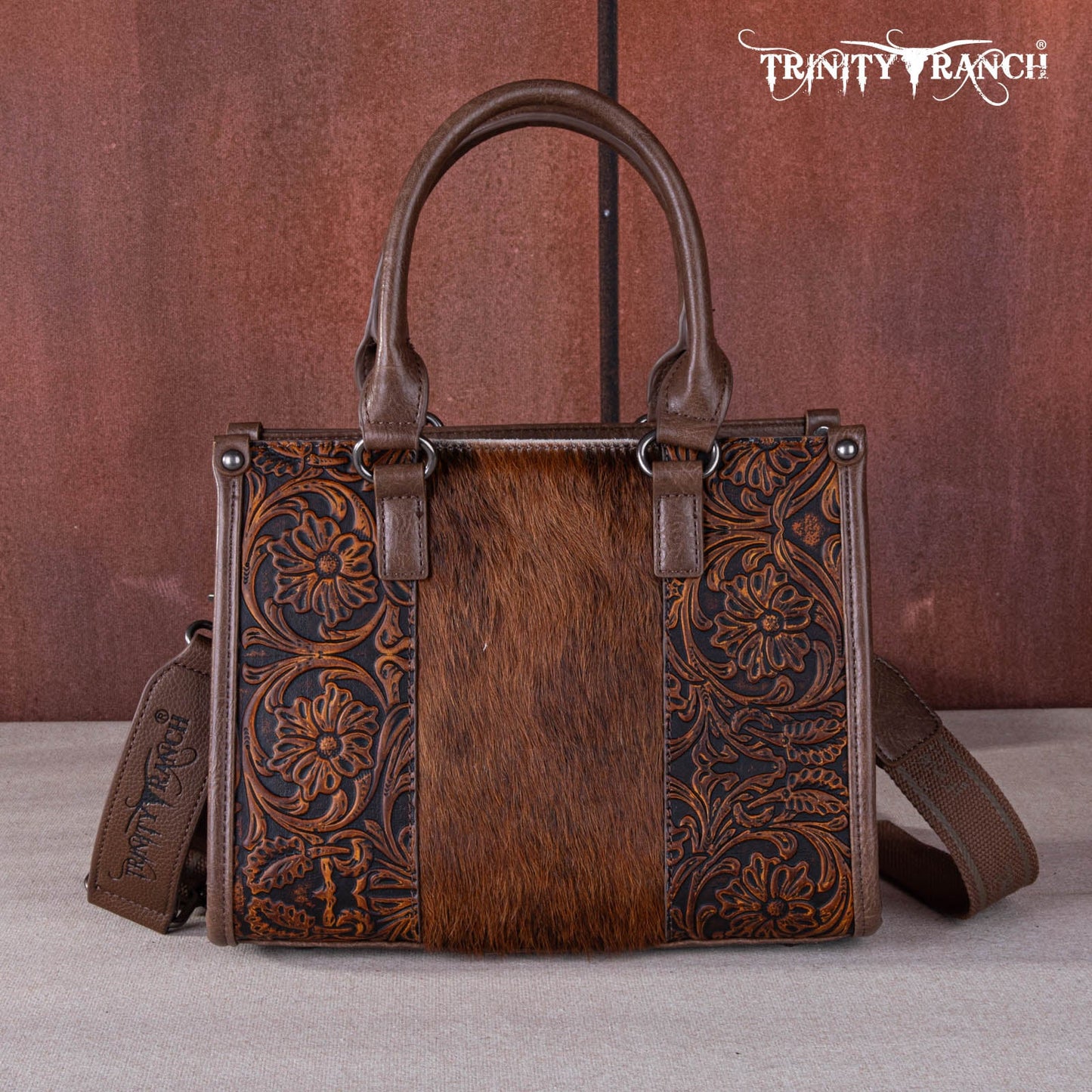 TR1648250 - Trinity Ranch Hair On Cowhide Tooling Concealed Carry Tote/Crossbody