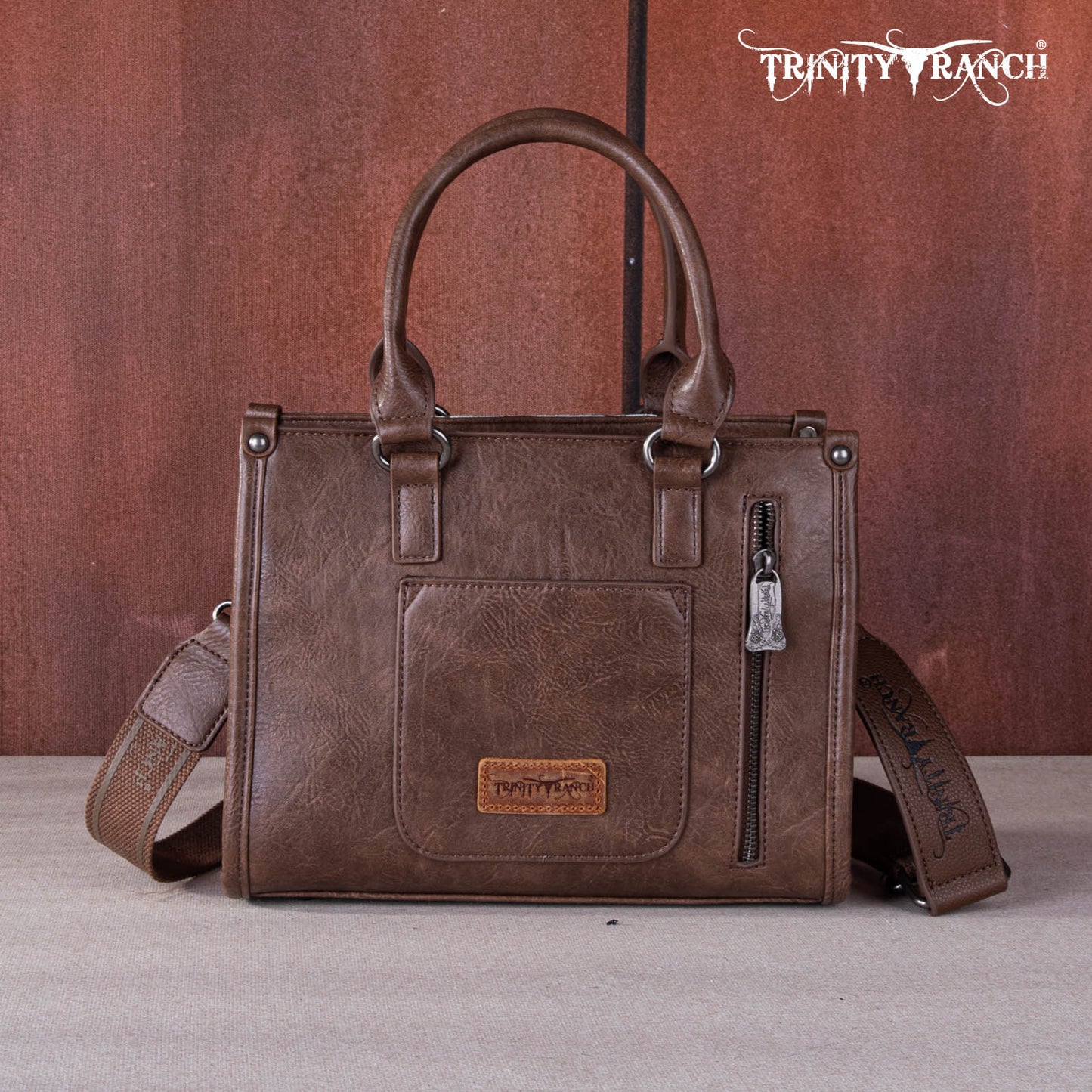 TR1648250 - Trinity Ranch Hair On Cowhide Tooling Concealed Carry Tote/Crossbody